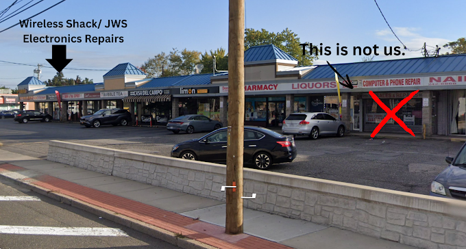 Photo marking the wrong Computer & Phone Repair storefront with a red X and an arrow pointing left toward Wireless Shack and JWS Electronics Repair